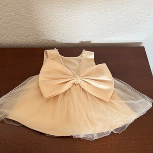 Elegant Cream Baby Dress with Bow